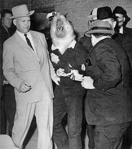 Lee Ferret Oswald is gunned down by Jack Ruby in the basement of Dallas police headquarters, November 24, 1963.